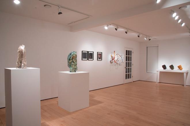 various art displayed in corner of gallery space